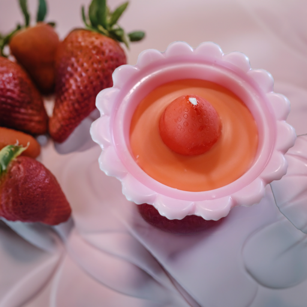 Luxury soy wax pink candle by Scent Fushion Candles, featuring a sweet strawberry scent and elegant footed glass design for aesthetic spaces.